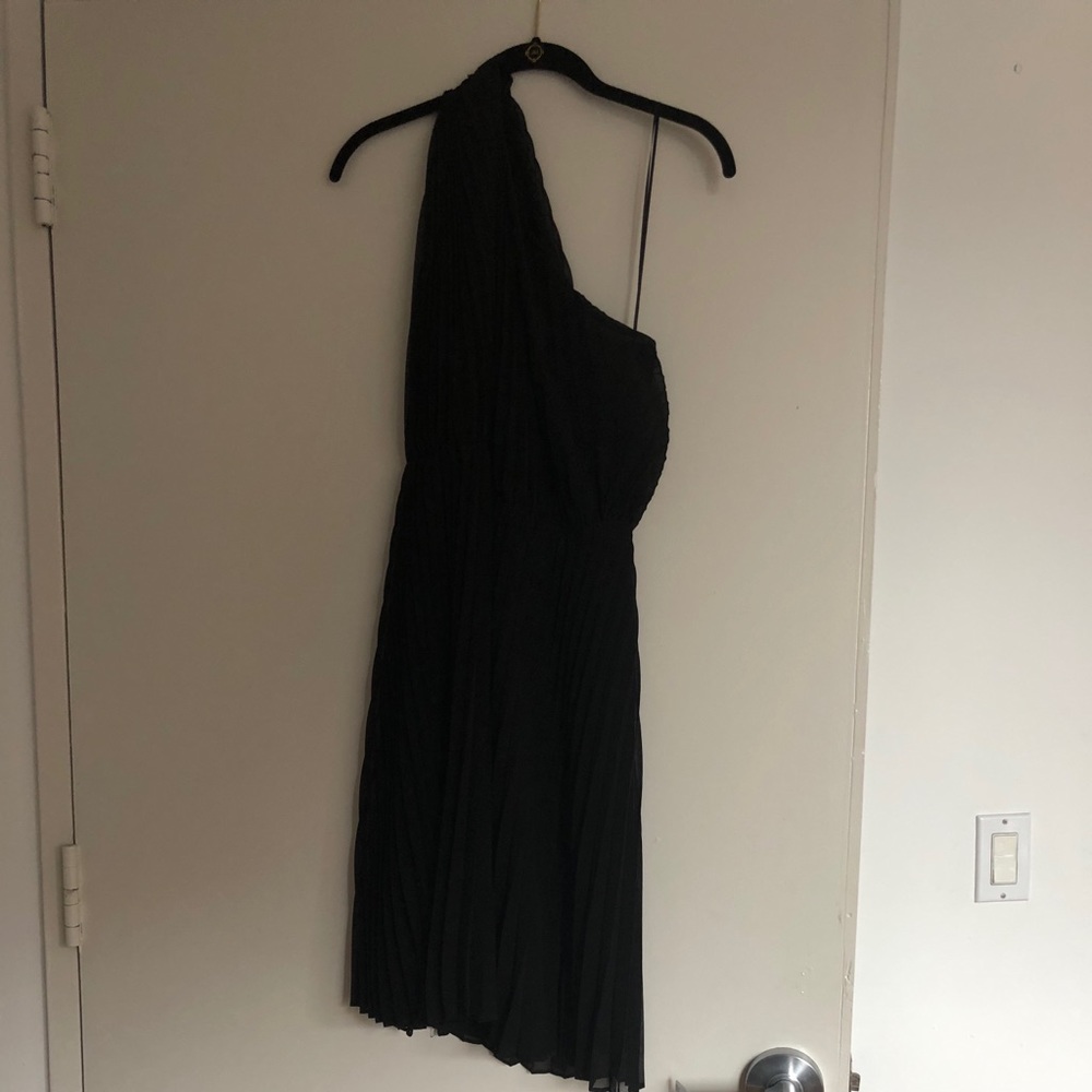 One shoulder black dress.